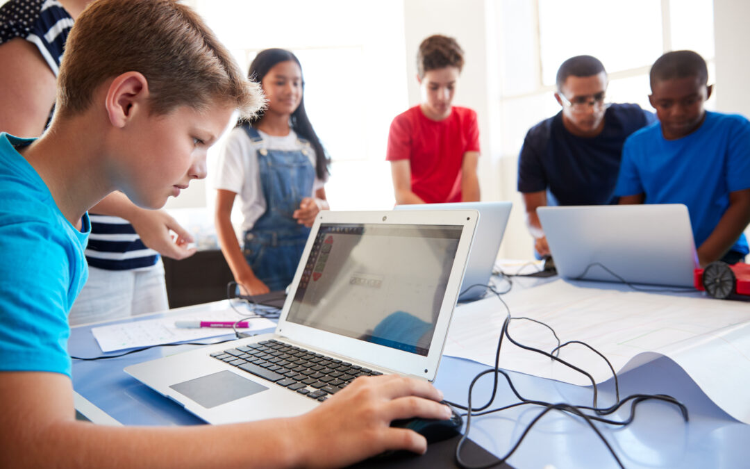 Group of students learning digital skills in classroom